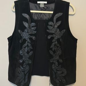 Suede vest.  Black with black embossed patches.  Very sophisticated and luxe